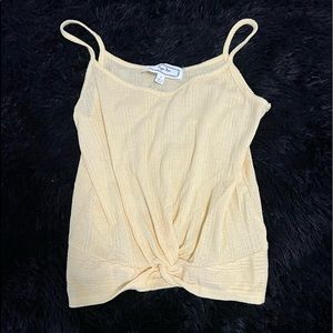 Yellow tank top, crosses in front, never worn.